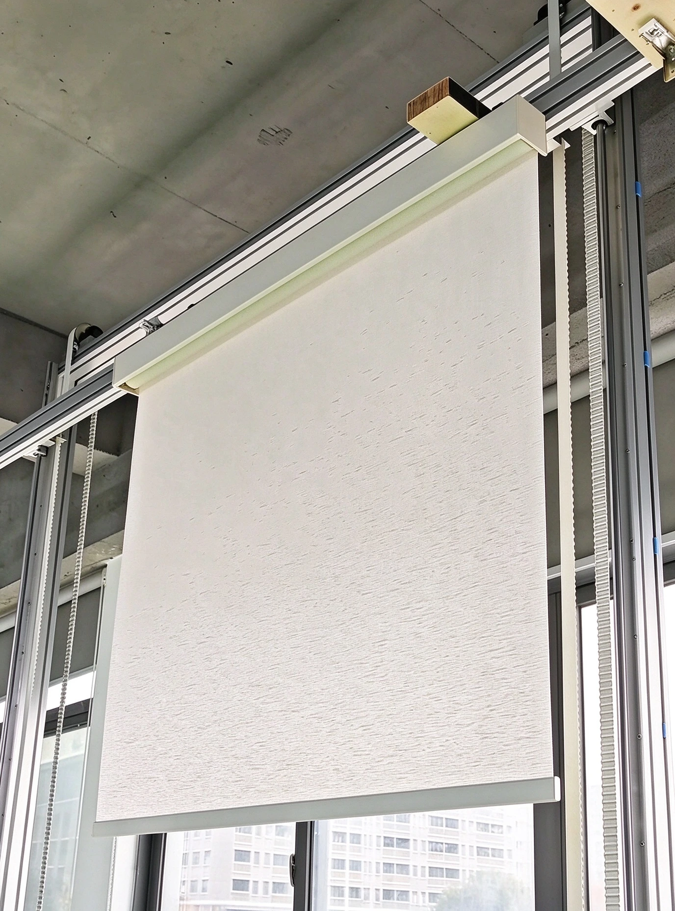 Finished roller blind with cassette system and chain control at UNITEC