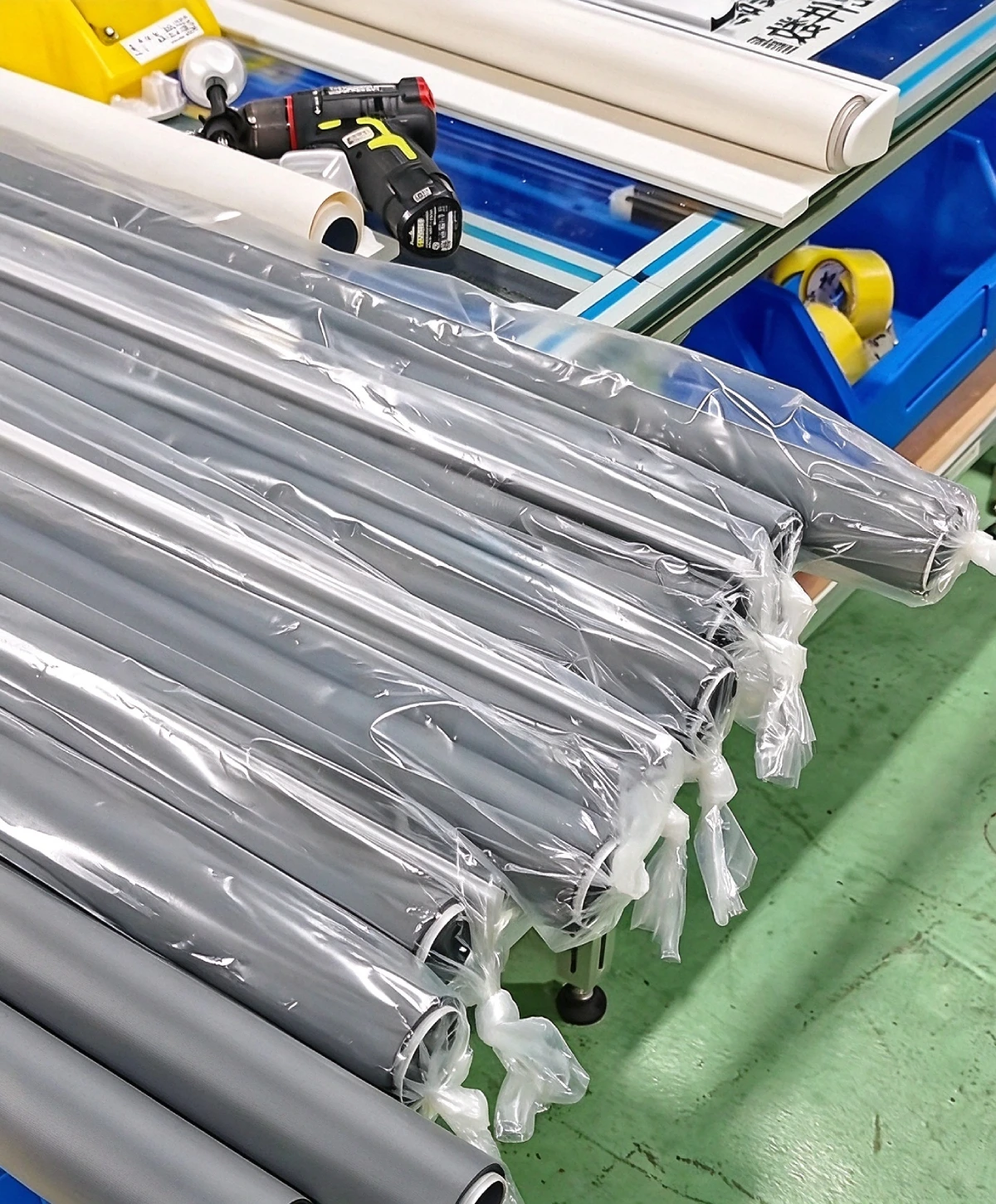 Finished roller blinds protected for packing at UNITEC